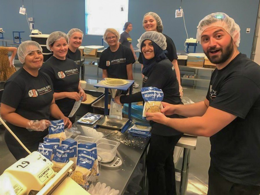Aneesa and the Pioneer Service team volunteer at Feed My Starving Children in 2019